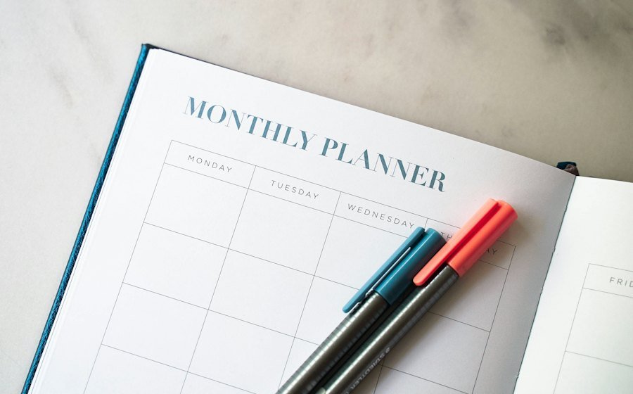 An open planner with two pens